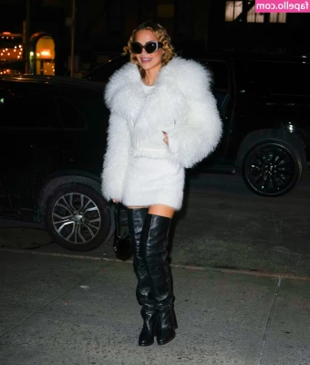 Rita Ora [ rita-ora ] - Sitting out side with no pants on  or anything else  Just this dog