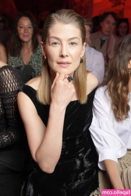 Rosamund Pike [ rosamund-pike ] - Waiting for my early flight to Quebec  first time flying Porter  Last