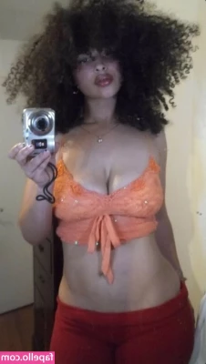 Sarina - looking down on you with my tits out  wearing a black strappy  