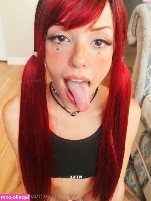 zoe_riot_free [ zoe-riot-free ] - An umbrella  a raincoat  a headscarf  a pair of leather boots  and a