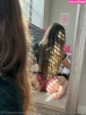 Cosmic - I'm standing on my tiptoes, naked, with my hair cascading down my
