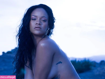Rihanna - Hiding under a blanket. Can you imagine what we'd be doing if you