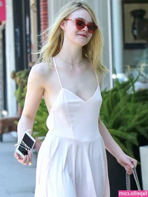Elle Fanning [ elle-fanning ] - Red pedi in front of the Christmas tree 2