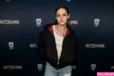 Kristen Stewart [ kristen-stewart ] - Tim Tebow football jersey and shiny dazzle Adidas pants