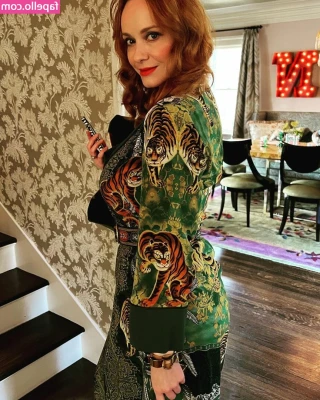 Christina Hendricks [ christina-hendricks ] - ✨🎃 ✨💜✨🎃✨ A woman whose costume appears to be cat